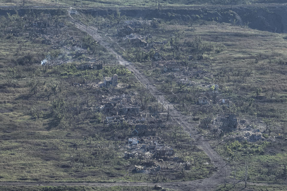 That image was taken from a drone on Wednesday Sept. 6, 2023, Houses are seen destroyed during the fighting between Russian and Ukrainian armed forces are seen in Andriivka, Donetsk region, Ukraine. Deputy Defense Minister Hanna Maliar said this morning Ukraine's General Staff officially confirmed that Ukrainian troops captured Andriivka, which is 10 km south of Bakhmut. (AP Photo/Evgeniy Maloletka)