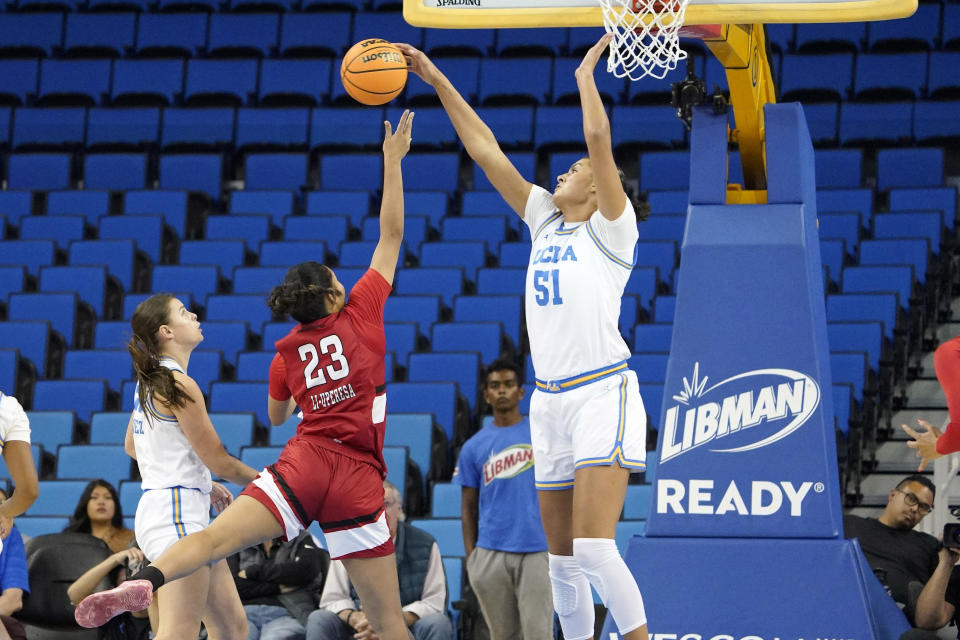 UCLA center Lauren Betts, right, blocks the shot of Cal State Northridge forward Talo Li-Uperesa, center, as forward Gabriela Jaquez watches during the first half of an NCAA college basketball game Thursday, Dec. 7, 2023, in Los Angeles. (AP Photo/Mark J. Terrill)