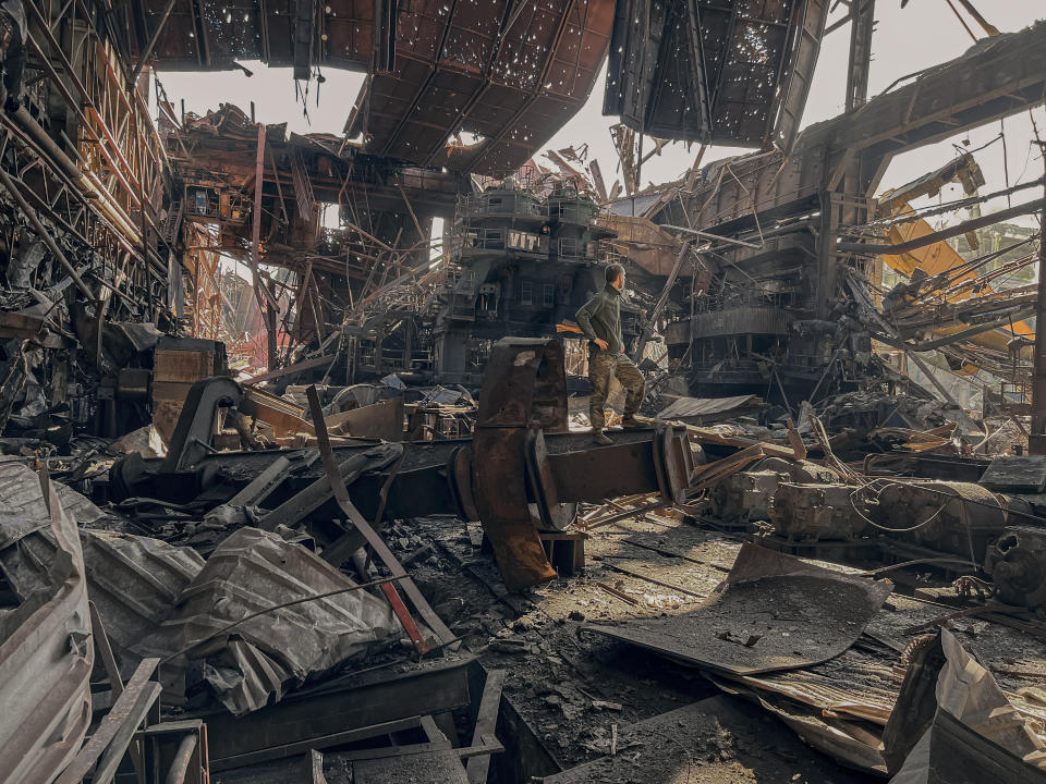 FILE - In this file photo provided by Azov Special Forces Regiment of the Ukrainian National Guard Press Office, a Ukrainian soldier stands inside the ruined Azovstal steel plant prior to surrender to the Russian forces in Mariupol, Ukraine, May 16, 2022. Russia's Supreme Court has declared Ukraine's Azov Regiment a terrorist organization and that designation could lead to terror charges against some of the captured fighters who made their last stand inside the shattered steel plant. (Dmytro Kozatski/Azov Special Forces Regiment of the Ukrainian National Guard Press Office via AP, File)