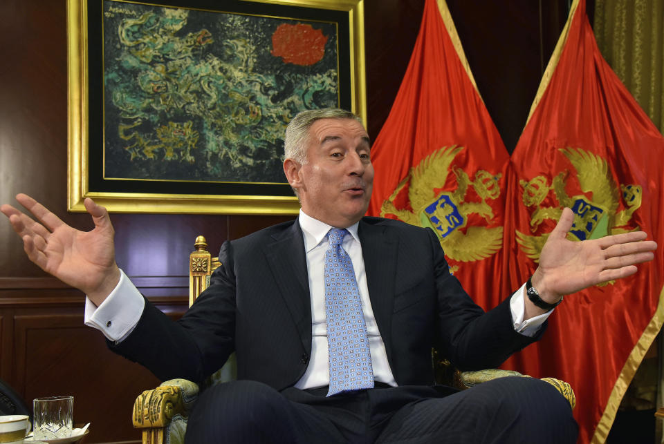 FILE - In this Thursday, April 4, 2019 file photo, Montenegro President Milo Djukanovic speaks and gestures during an interview to The Associated Press in Montenegro's capital Podgorica. Montenegro's president says the upcoming parliamentary vote is crucial in the defense of the small Balkan country's independence in the face of renewed attempts from Serbia and Russia to install their nationalist and anti-Western allies to power. (AP Photo/Risto Bozovic, File)