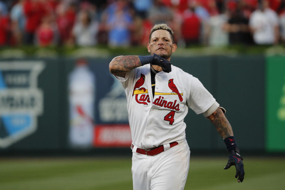 St. Louis Cardinals' Yadier Molina celebrates after hitting a sacrifice fly to score Kolten Wong and defeat the Atlanta Braves in Game 4 of a baseball National League Division Series, Monday, Oct. 7, 2019, in St. Louis. (AP Photo/Jeff Roberson)