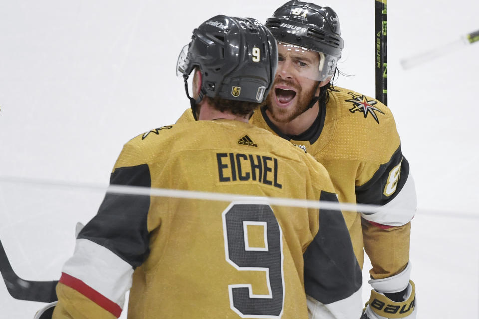 Vegas Golden Knights right wing Jonathan Marchessault (81) celebrates with teammate Jack Eichel (9) after a goal during the third period of Game 2 of the NHL hockey Stanley Cup Western Conference finals, Sunday, May 21, 2023, in Las Vegas. (AP Photo/Sam Morris)