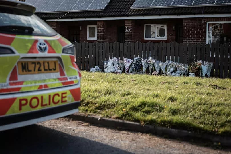 Tributes at the scene on Marsh Green