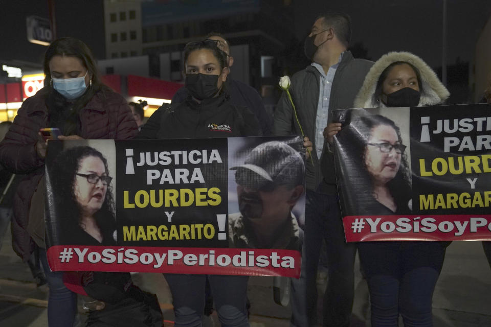 People and journalists join a national protest against the murder of journalist Lourdes Maldonado and freelance photojournalist Margarito Martínez, outside the attorney general's office in Tijuana, Mexico, Tuesday, Jan. 25, 2022. Mexico's Interior Undersecretary Alejandro Encinas said recently that more than 90% of murders of journalists and rights defenders remain unresolved, despite a government system meant to protect them. (AP Photo/Marco Ugarte)