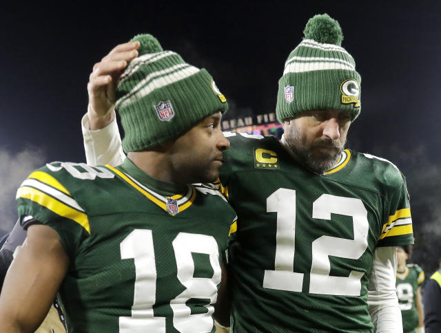 Jan 8, 2023; Green Bay, Wisconsin, USA; Green Bay Packers quarterback Aaron Rodgers (12) and wide receiver Randall Cobb (18) leave the field after losing to the Detroit Lions 20-16 during their football game at Lambeau Field. Mandatory Credit: William Glasheen/Appleton Post-Crescent via USA TODAY NETWORK