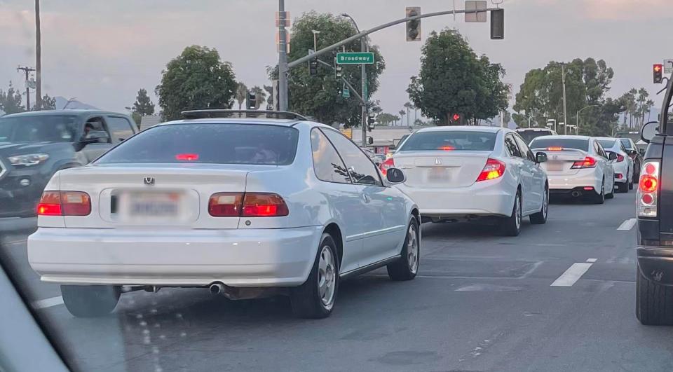 Four Hondas at a stop light