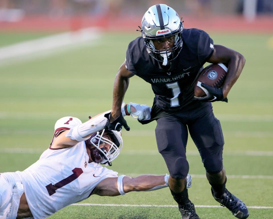 Miles Coleman shakes off a Dripping Springs defender and looks for the end zone as his Vandegrift Vipers try to regain the lead against the Tigers Aug. 26 at Monroe Stadium. The Tigers earned a 23-20 victory over the host Vipers. 