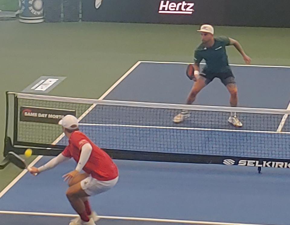 Ben Johns delivers a backhand during his win over Tyson McGuffin in Sunday's men's singles final.