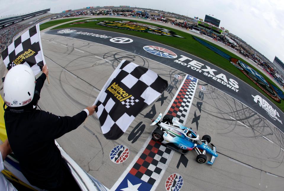 FORT WORTH, TEXAS - APRIL 02: Josef Newgarden, driver of the #2 PPG Team Penske Chevrolet, takes the checkered flag to win the NTT IndyCar Series PPG 375 at Texas Motor Speedway on April 02, 2023 in Fort Worth, Texas.