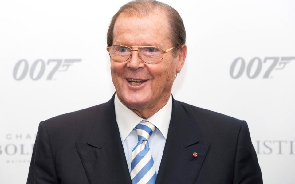 Actor Sir Roger Moore attends the 50 Years of James Bond Auction at Christies in London, October 5, 2012 - Credit: Reuters / Neil Hall