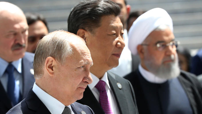 From left: Belarusian President Alexander Lukashenko, Russian President Vladimir Putin, Chinese President Xi Jinping and then-Iranian President Hassan Rouhani enter the hall during the SCO Summit in 2019 in Bishkek, Kyrgyzstan. 