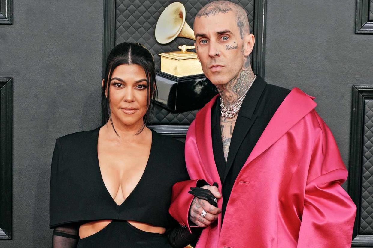 LAS VEGAS, NEVADA - APRIL 03: (L-R) Kourtney Kardashian and Travis Barker attend the 64th Annual GRAMMY Awards at MGM Grand Garden Arena on April 03, 2022 in Las Vegas, Nevada. (Photo by Jeff Kravitz/FilmMagic)