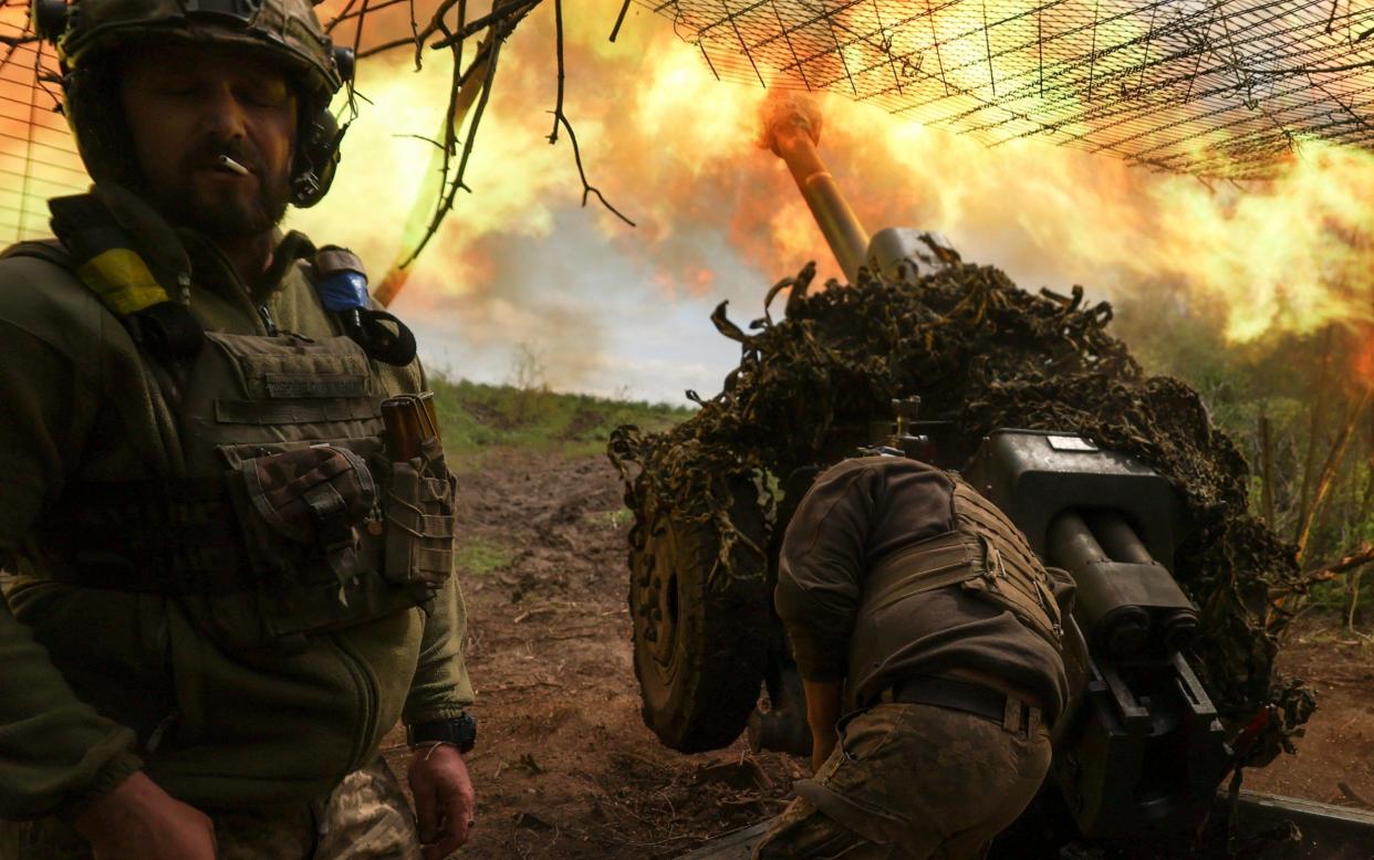 Ukrainian troops of the 10th Mountain Assault Brigade fire at the front line near Soledar - Reuters