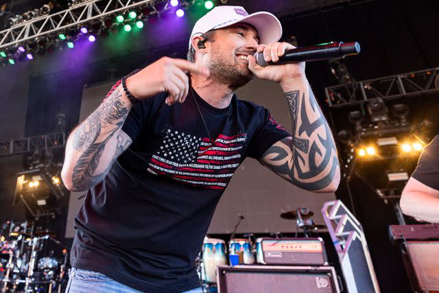 <p>Scott Legato/Getty</p> Michael Ray performs in Sterling Heights, Michigan in 2022.