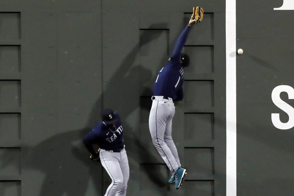 Seattle Mariners' Kyle Lewis (1) can not make the catch beside Taylor Trammell on a triple by Boston Red Sox's Enrique Hernandez during the seventh inning of a baseball game Thursday, April 22, 2021, in Boston. (AP Photo/Michael Dwyer)