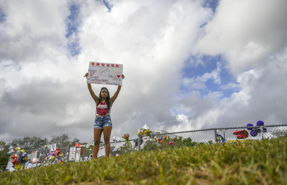 A student at Marjory Stoneman Douglas High School, where 17 students and teachers were killed in a February 14th shooting, protests in support of gun laws. (Photo: Getty Images)