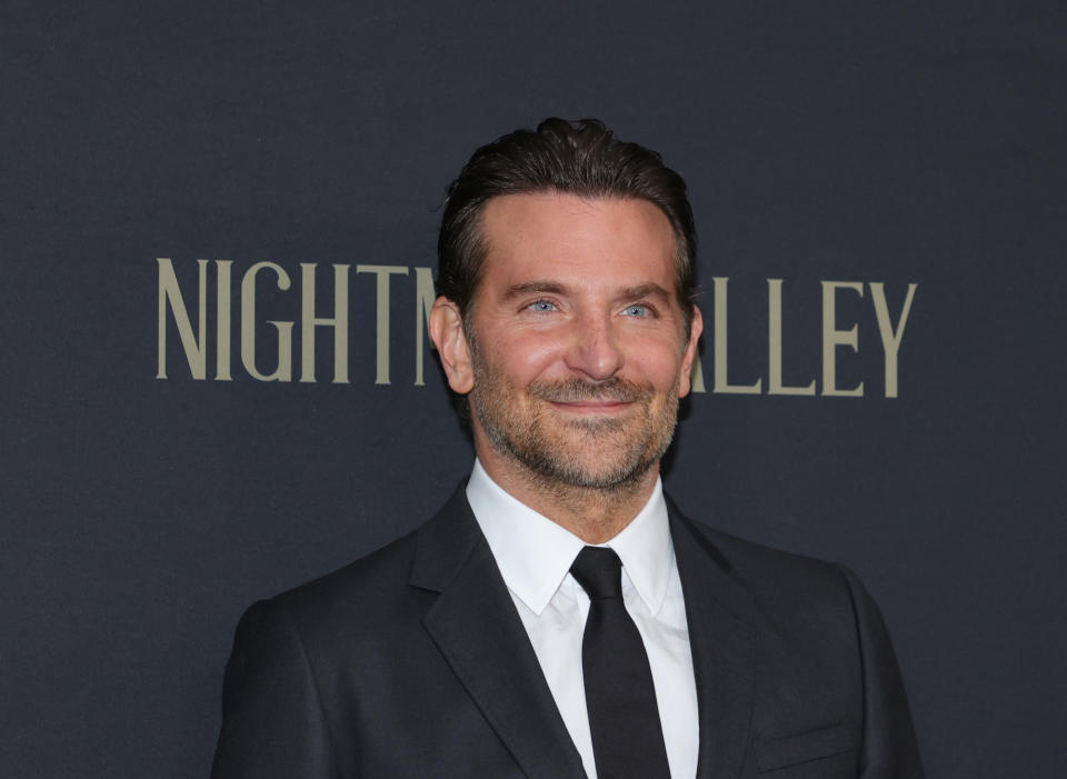 Bradley Cooper smiles at the "Nightmare Alley" premiere in 2021