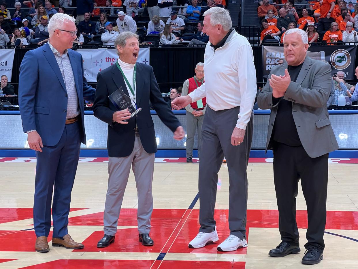 Former Ohio State football player Dick LeBeau, a member of the Pro Football Hall of Fame, shares a laugh with former Ohio State basketball player Bill Hosket during the OHSAA Circle of Champions ceremony Saturday at the boys basketball state tournament. Also pictured are former Ohio State quarterback Bob Hoying, left, and OHSAA executive director Doug Ute.