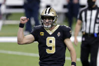 New Orleans Saints quarterback Drew Brees (9) reacts after throwing a touchdown pass to Michael Thomas in the first half of an NFL wild-card playoff football game against the Chicago Bears in New Orleans, Sunday, Jan. 10, 2021. (AP Photo/Brett Duke)