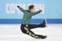 Italy's Paul Bonifacio Parkinson falls during the figure skating men's short program at the Sochi 2014 Winter Olympics, February 13, 2014. REUTERS/Lucy Nicholson (RUSSIA - Tags: SPORT FIGURE SKATING OLYMPICS)