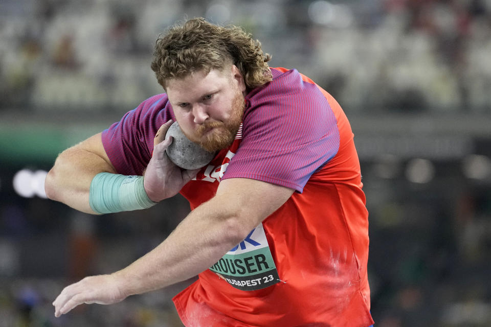 FILE - Ryan Crouser, of the United States, makes an attempt in the men's shot put final during the World Athletics Championships in Budapest, Hungary, Saturday, Aug. 19, 2023. Everything is trending in the right direction for the shot put world champion after being diagnosed with two blood clots in his left leg just before his win at the world championships last month. (AP Photo/Matthias Schrader, File)