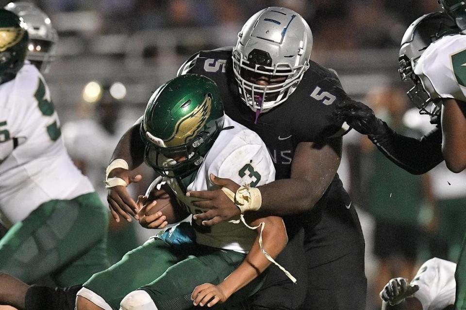 South Garner’s Nnamdi Ogboko (5) tackles Enloe’s Marquis Fenton (3) during the second half. The Enloe Eagles and the South Garner Titans met in a non-conference game in Wake Forest, N.C. on September 8, 2023.