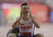 Karsten Warholm, of Norway wins the gold medal in the men's 400m hurdles final at the World Athletics Championships in Doha, Qatar, Monday, Sept. 30, 2019. (AP Photo/Petr David Josek)