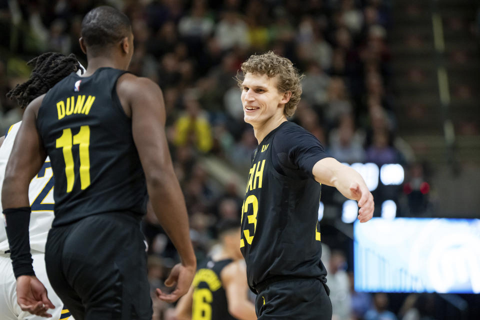 Utah Jazz forward Lauri Markkanen, right, celebrates with guard Kris Dunn (11) after scoring during the second half of an NBA basketball game against the Indiana Pacers, Monday, Jan. 15, 2024, in Salt Lake City. (AP Photo/Spenser Heaps)