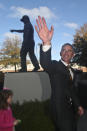 Florida State head football coach Mike Norvell waves as he passes by the Bobby Bowden statue prior to a news conference Sunday, Dec. 8, 2019, in Tallahassee, Fla. Norvell is Florida State’s new coach, taking over a Seminoles program that has struggled while he was helping to build Memphis into a Group of Five power. (AP Photo/Phil Sears)