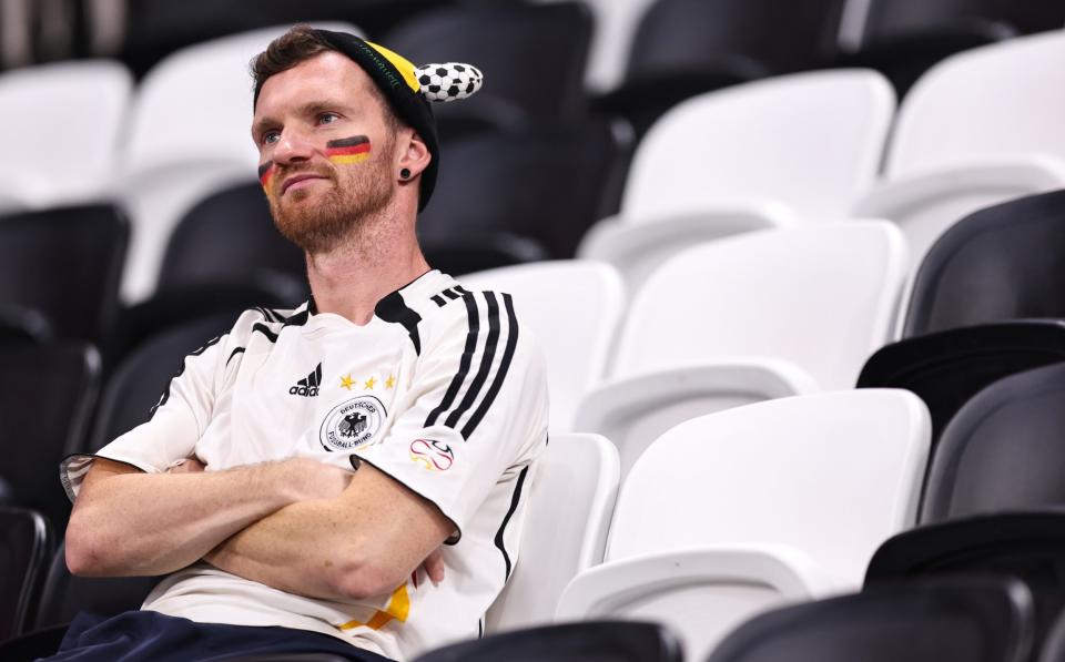 A dejected fan of Germany after both teams are knocked out the FIFA World Cup in the group stages during the FIFA World Cup Qatar 2022 Group E match between Costa Rica and Germany at Al Bayt Stadium - Robbie Jay Barratt/Getty Images