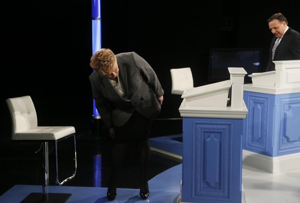 Parti Quebecois leader Pauline Marois checks her podium prior to Quebec's political leaders debate in Montreal