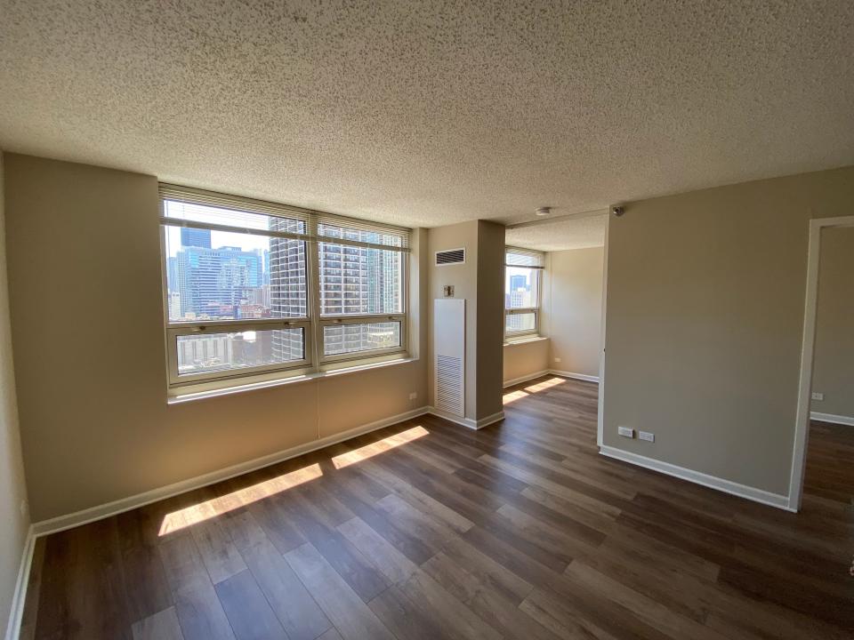 the living room and bedroom in 750 n rush in chicago