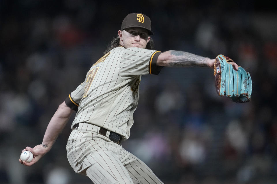 FILE - San Diego Padres' Josh Hader winds up during a baseball game against the San Francisco Giants in San Francisco, Sept. 26, 2023. Hard-throwing reliever Hader and the Houston Astros finalized a $95 million, five-year contract Monday, Jan. 22, 2024. Hader will get a $19 million salary in each of the next five seasons, none of it deferred. (AP Photo/Jeff Chiu, File)