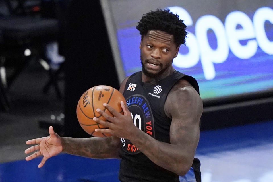 New York Knicks forward Julius Randle (30) holds onto the ball before driving down court during the first half of an NBA basketball game against the Orlando Magic, Monday, Jan. 18, 2021, in New York. (AP Photo/Kathy Willens, Pool)