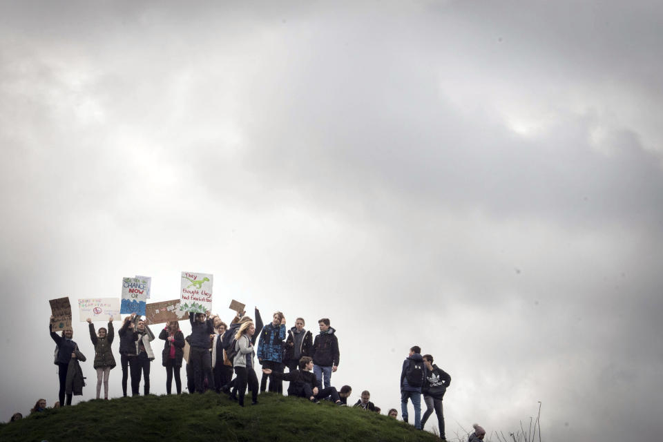 Students take part in a global protest for climate change in Cambridge city centre, England, Friday March 15, 2019. Angry students mobilized by word of mouth and social media skipped class Friday to protest what they believe are their governments' failure to take though action against global warming. (Stefan Rousseau/PA via AP)