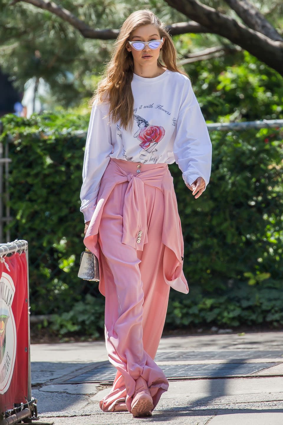 <p>In an Adam Selman graphic long sleeve tee and pink trousers with pink Reebok sneakers, Stalvey bag and Le Specs x Adam Selman cat eye sunglasses while out in New York.<br></p>