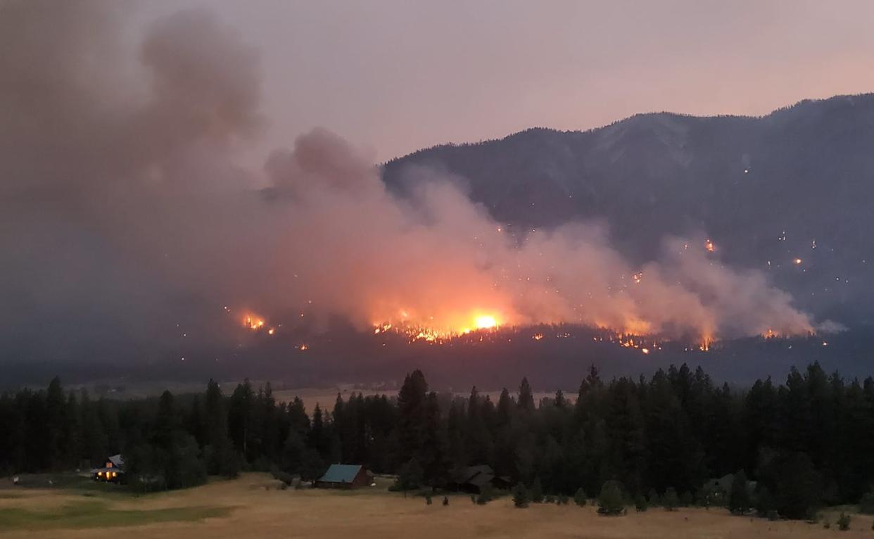 <span class="caption">The Cedar Creek Fire burns in Washington's Methow Valley in late July 2021.</span> <span class="attribution"><span class="source">Jessica Kelley</span></span>