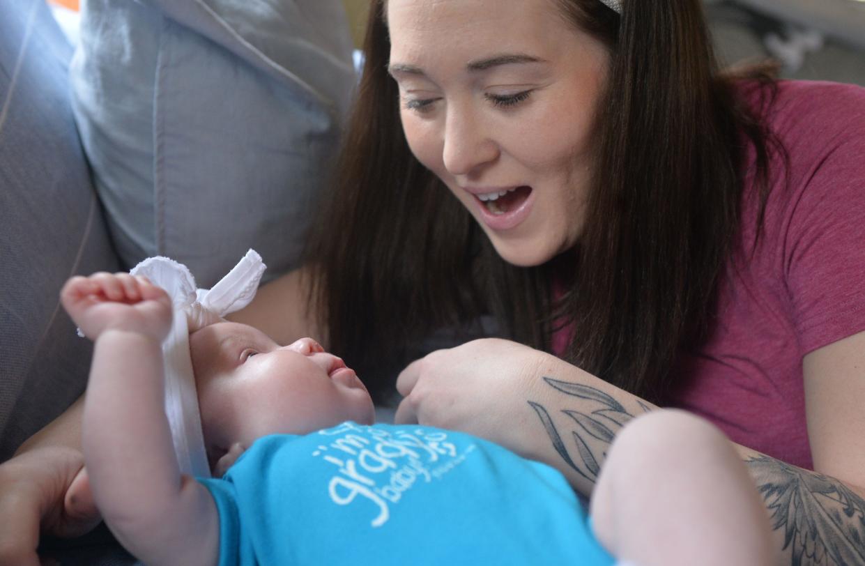 Maria Hodapp, 33. talks to her infant daughter Lorelai Edwards at their home in North East Township. Unexpected complications during Lorelai's birth put both of their lives in danger.