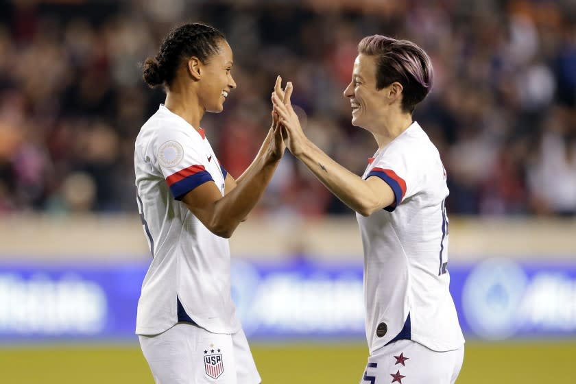 U.S. forwards Lynn Williams and Megan Rapinoe, right, celebrate a goal by Williams during the first half of a CONCACAF women's Olympic qualifying match against Panama on Jan. 31.