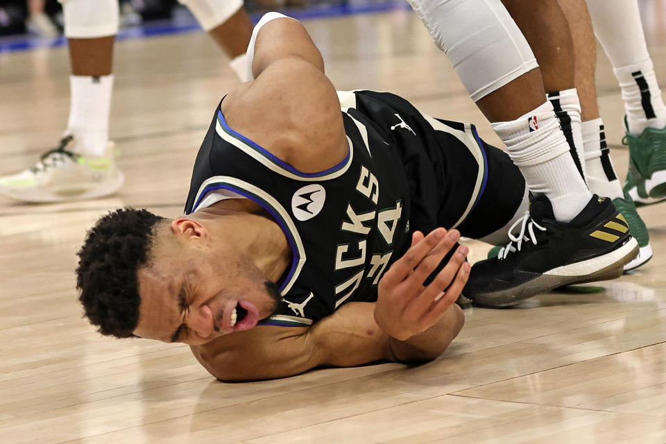 MILWAUKEE, WISCONSIN - APRIL 16: Giannis Antetokounmpo #34 of the Milwaukee Bucks is injured during Game One of the Eastern Conference First Round Playoffs against the Miami Heat at Fiserv Forum on April 16, 2023 in Milwaukee, Wisconsin. NOTE TO USER: User expressly acknowledges and agrees that, by downloading and or using this photograph, User is consenting to the terms and conditions of the Getty Images License Agreement. (Photo by Stacy Revere/Getty Images)