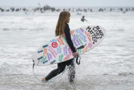 Surfers participate in a paddle out ceremony at "The Ink Well," a beach historically known as a surfing refuge for African Americans, to honor the life of George Floyd on Friday, June 5, 2020, in Santa Monica, Calif. Floyd died after he was restrained in police custody on Memorial Day in Minneapolis. (AP Photo/Ashley Landis)