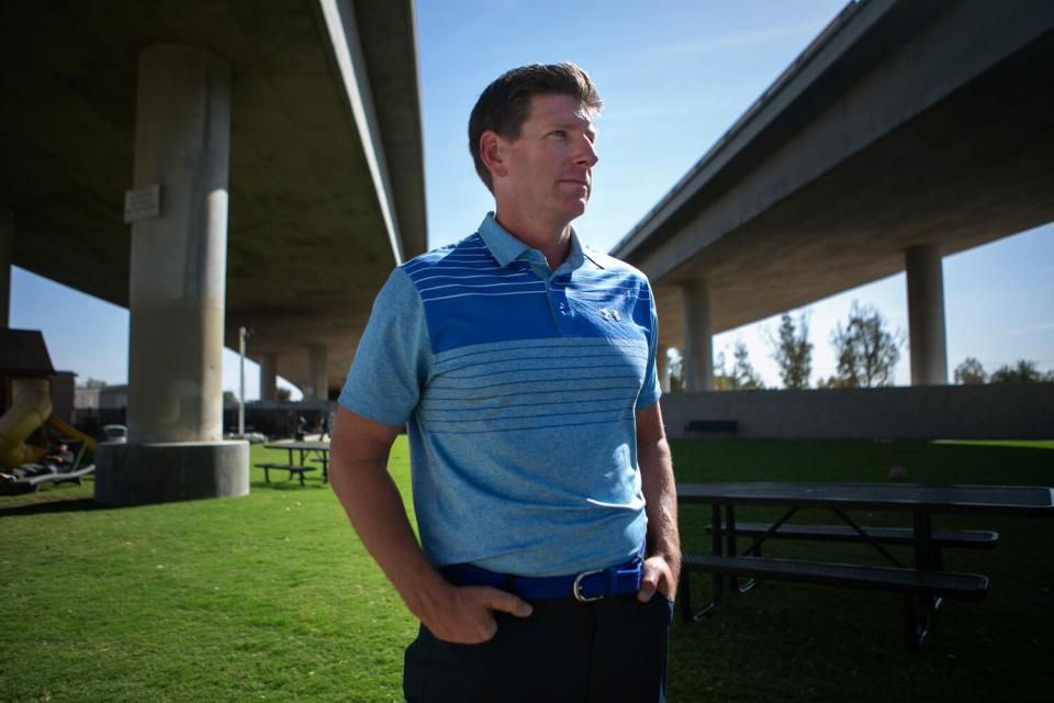 Matthew Dildine stands in the recreation yard on the site of the temporary rescue mission facility