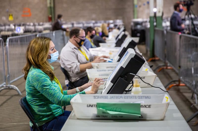Poll workers tabulate ballots at the Allegheny County Election Warehouse in Pittsburgh