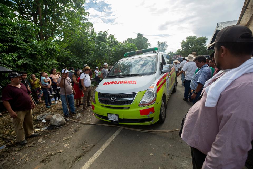 Protestors allow an ambulance to cross south at one of the blockades on Highway 2 on Oct. 8, 2023.