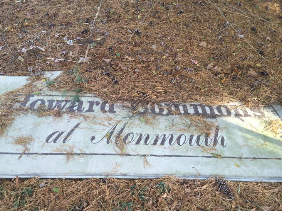 A sign for Howard Commons, shuttered military housing at the former Fort Monmouth in Eatontown, has fallen to the ground.