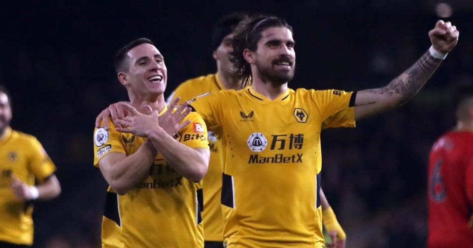 Wolverhampton Wanderers' Daniel Podens (left) celebrates with Ruben Neves after scoring his team's third goal in a Premier League game at Molineux Stadium in Wolverhampton. Credit: Alamy