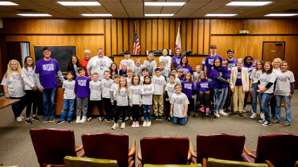 PHOTO: Jasmine, 9, poses for a photo with her family and classmates Monday, on her adoption day at Morgan County Courthouse in Decatur, Alabama. (Courtesy of Kyle Root)