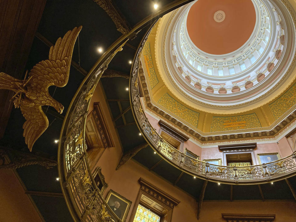 The rotunda at New Jersey's statehouse, along with new lighting, has been spruced up with a new coat of paint to match the way the building looked more than 100 years ago, Wednesday March 22, 2023,, in Trenton, N.J. The building has been reopened and reoccupied by the governor's and other executive staff after a nearly six year, $300-million renovation. (AP Photo/Mike Catalini)