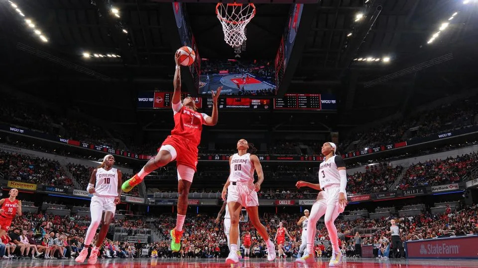 The Fever's NaLyssa Smith scores a layup during the matchup. - Ron Hoskins/NBAE/Getty Images