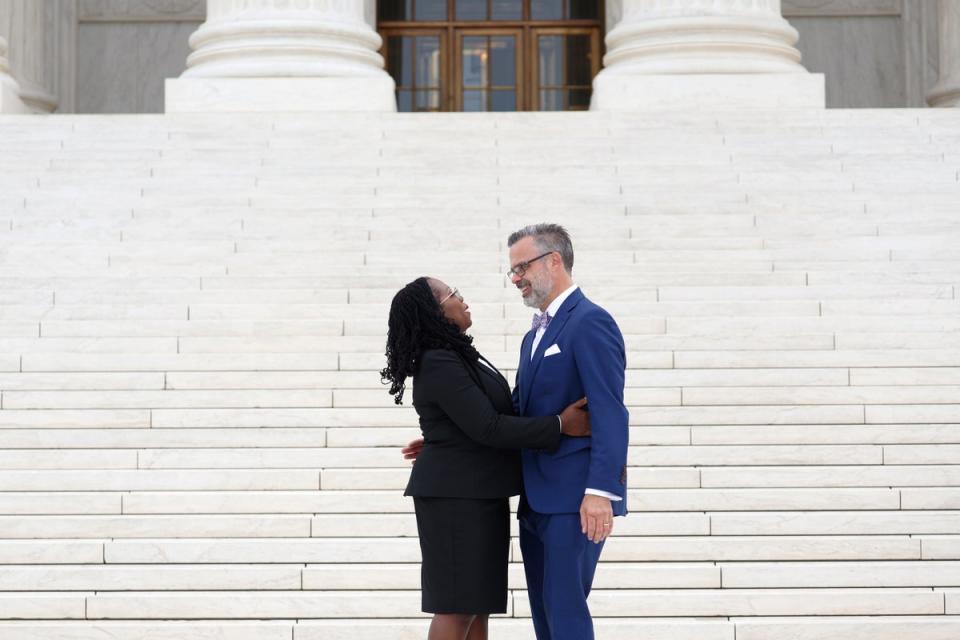 Justice Ketanji Brown Jackson kisses her husband Patrick Jackson in front of the US Supreme Court following her investiture ceremony on 30 September. (Getty Images)